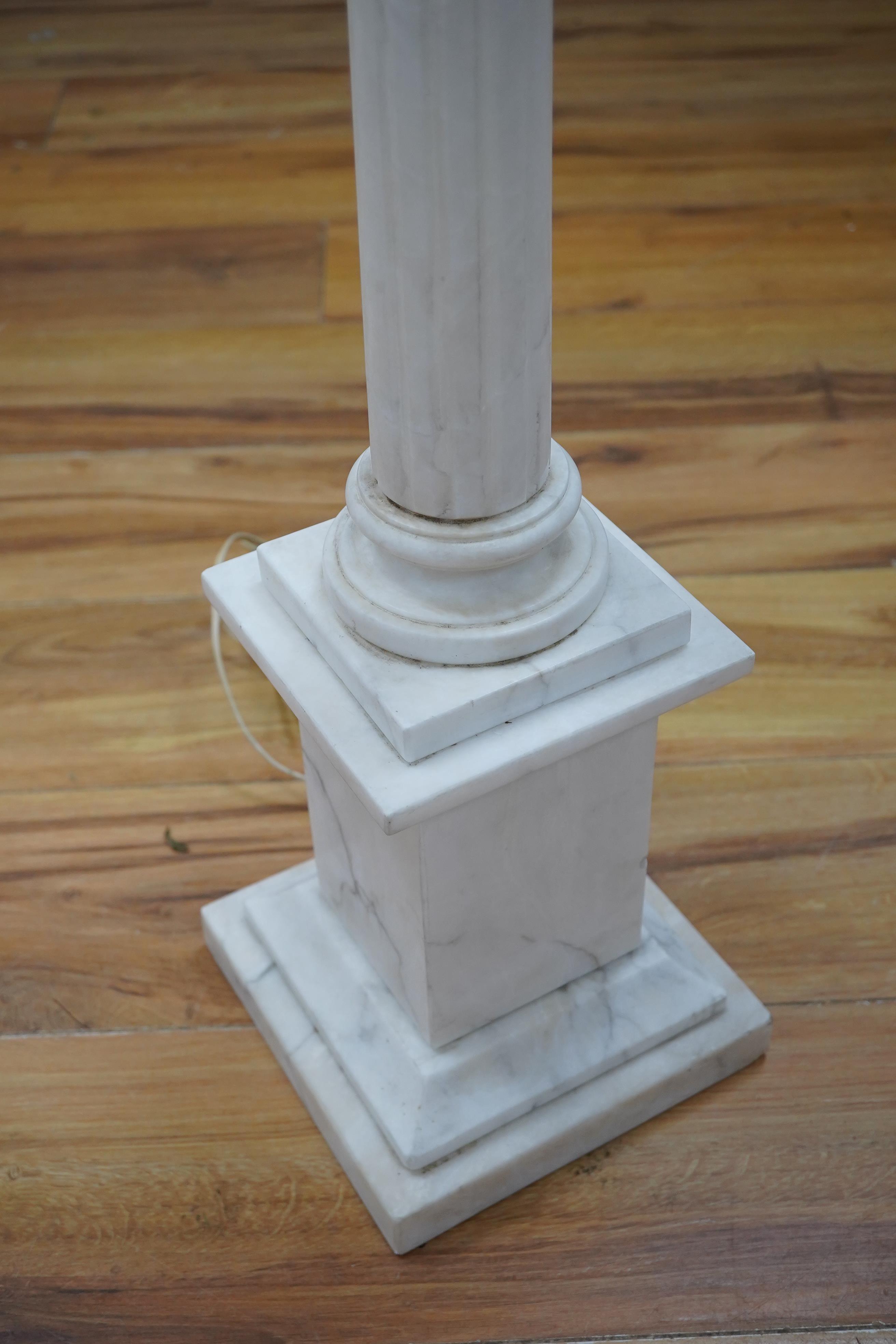 A large white marble Corinthian column table lamp, 80cm high. Condition - small section broken and the reglued to stem